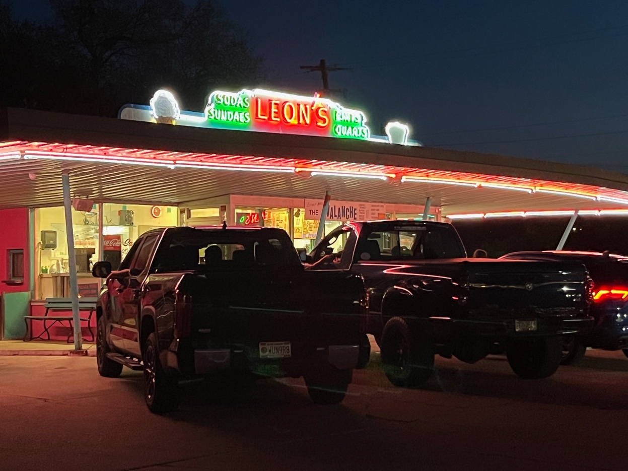 Leon's at night with neon lights